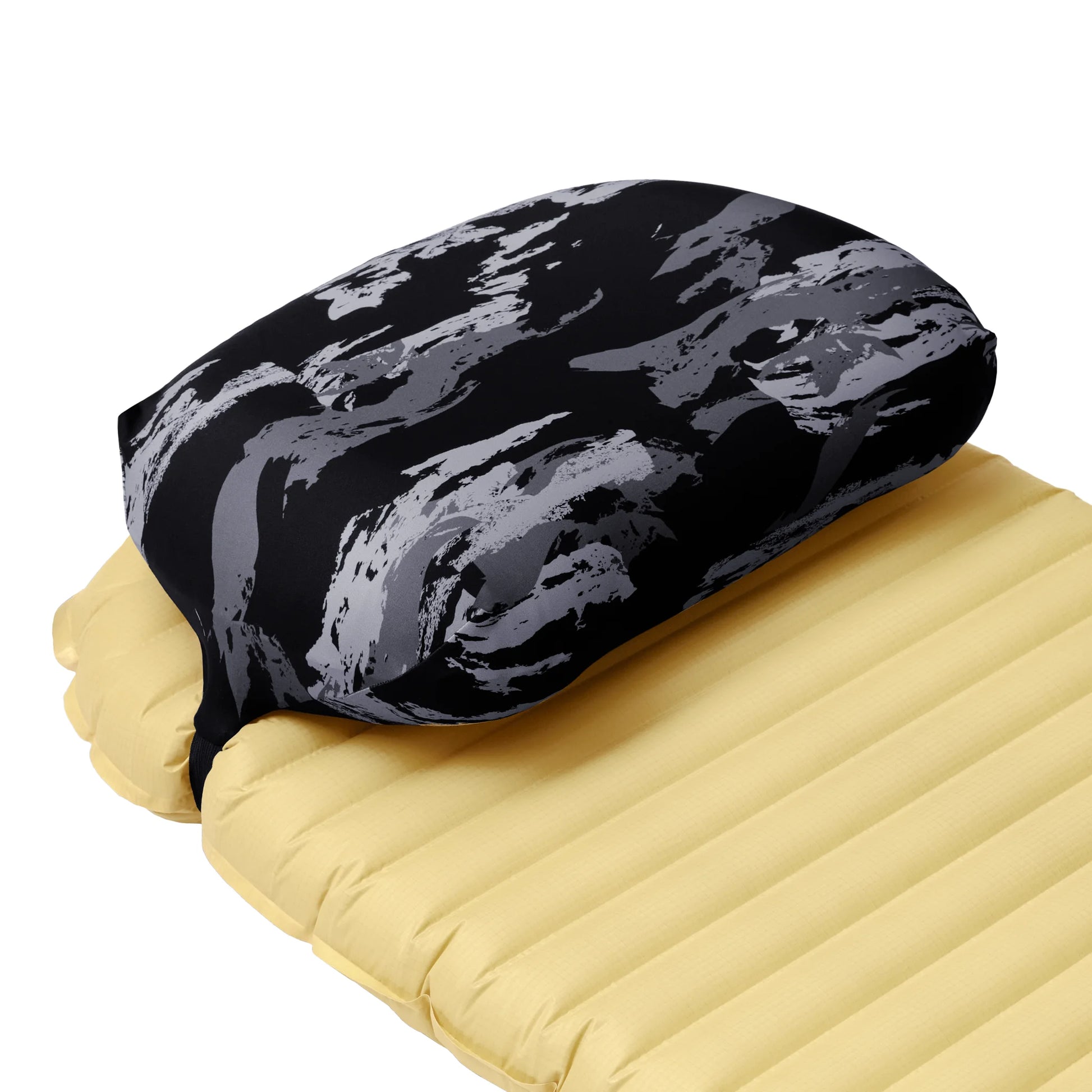 Pillow Strap medium size camping pillow case in Night Shadows on a sleeping pad. Three quarter view.